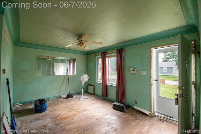 3500 Hogarth Ave, Flint, MI 48532 - empty room featuring healthy amount of natural light, wood finished floors, and a ceiling fan