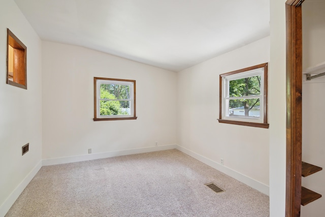 1279 Cunningham, Jackson, MI 49201 - spare room featuring healthy amount of natural light, carpet flooring, and baseboards