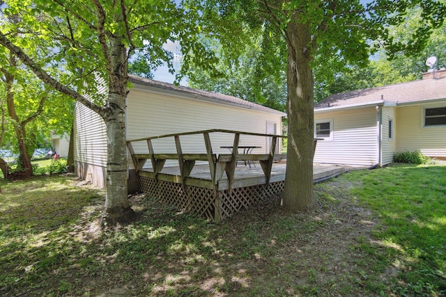 1279 Cunningham, Jackson, MI 49201 - back of property featuring a wooden deck and a lawn