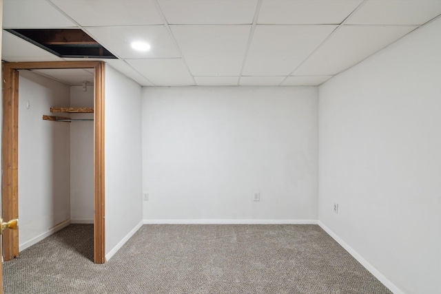 1279 Cunningham, Jackson, MI 49201 - unfurnished bedroom with carpet, a spacious closet, a paneled ceiling, and baseboards