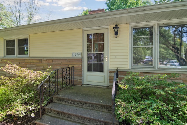 1279 Cunningham, Jackson, MI 49201 - property entrance with a chimney