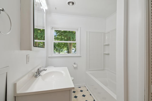 1279 Cunningham, Jackson, MI 49201 - bathroom featuring toilet, vanity, ornamental molding, and shower / tub combination