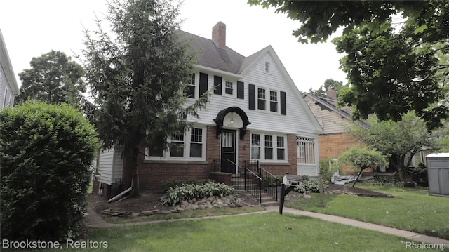 22101 Francis St, Dearborn, MI 48124 - view of front of property featuring brick siding, a chimney, and a front yard
