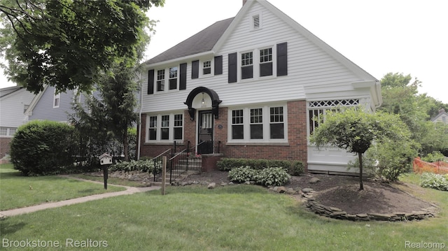 22101 Francis St, Dearborn, MI 48124 - view of front of home with brick siding and a front yard