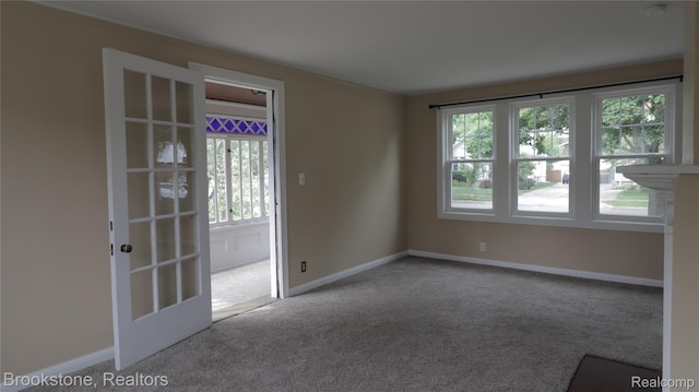 22101 Francis St, Dearborn, MI 48124 - unfurnished room featuring healthy amount of natural light, carpet floors, and baseboards