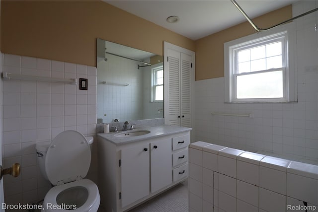 22101 Francis St, Dearborn, MI 48124 - bathroom with tile walls, vanity, toilet, tile patterned floors, and healthy amount of natural light