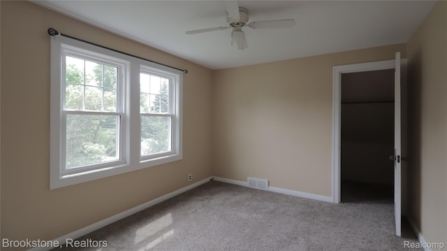 22101 Francis St, Dearborn, MI 48124 - empty room featuring healthy amount of natural light, baseboards, carpet floors, and a ceiling fan