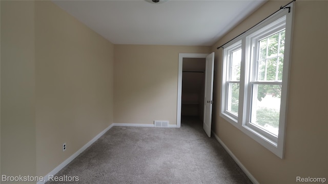 22101 Francis St, Dearborn, MI 48124 - carpeted empty room featuring healthy amount of natural light and baseboards