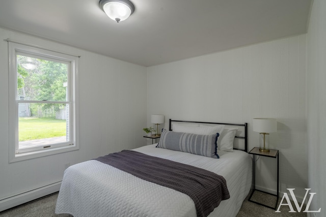 7936 Whitehall Rd, Whitehall, MI 49461 - carpeted bedroom featuring a baseboard heating unit and multiple windows