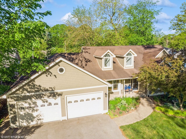 224 S Jameson St, New Buffalo, MI 49117 - view of front of property with asphalt driveway, an attached garage, and covered porch