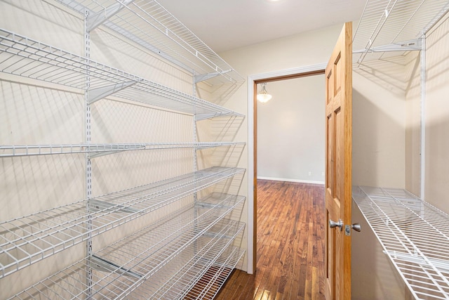 224 S Jameson St, New Buffalo, MI 49117 - walk in closet featuring wood finished floors
