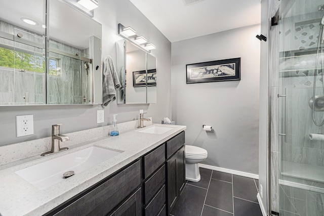 224 S Jameson St, New Buffalo, MI 49117 - bathroom with a stall shower, tile patterned flooring, double vanity, baseboards, and toilet