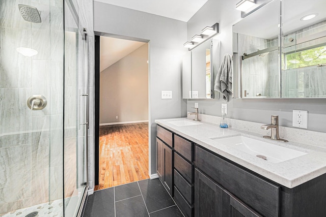 224 S Jameson St, New Buffalo, MI 49117 - bathroom with a stall shower, double vanity, baseboards, and tile patterned flooring