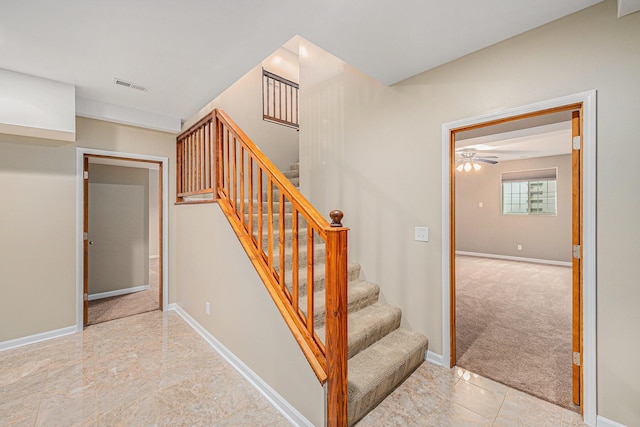 224 S Jameson St, New Buffalo, MI 49117 - stairway featuring a ceiling fan, carpet, and baseboards