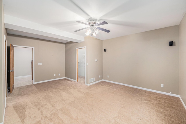 224 S Jameson St, New Buffalo, MI 49117 - unfurnished bedroom with light carpet, baseboards, and a walk in closet
