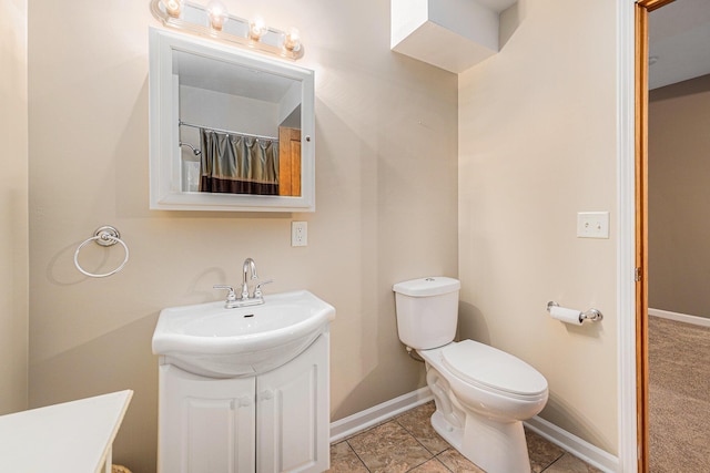 224 S Jameson St, New Buffalo, MI 49117 - bathroom featuring vanity, toilet, baseboards, and tile patterned flooring