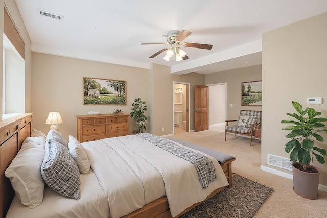 224 S Jameson St, New Buffalo, MI 49117 - bedroom with light carpet, baseboards, a ceiling fan, and connected bathroom