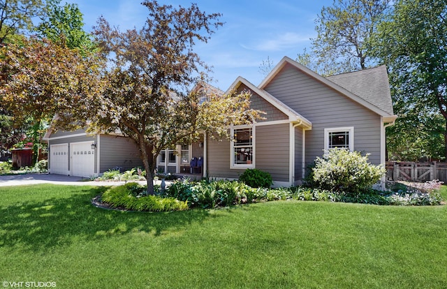 224 S Jameson St, New Buffalo, MI 49117 - view of front of property featuring a garage, concrete driveway, and roof with shingles
