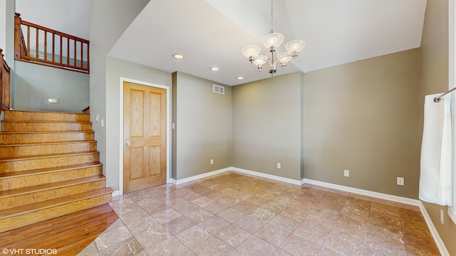 224 S Jameson St, New Buffalo, MI 49117 - unfurnished room with a chandelier, stairs, baseboards, and recessed lighting