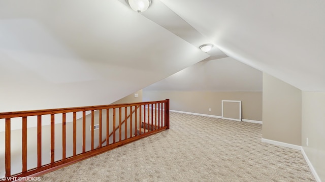 224 S Jameson St, New Buffalo, MI 49117 - bonus room featuring baseboards, lofted ceiling, and carpet floors