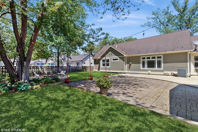 224 S Jameson St, New Buffalo, MI 49117 - back of property with a patio, central AC unit, and roof with shingles