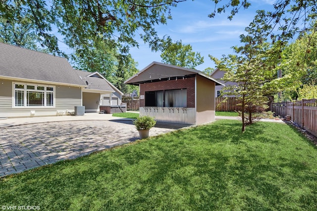 224 S Jameson St, New Buffalo, MI 49117 - view of yard with central AC, an outdoor structure, and a patio area