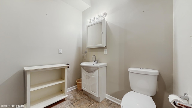 224 S Jameson St, New Buffalo, MI 49117 - bathroom featuring vanity, toilet, baseboards, and tile patterned floors