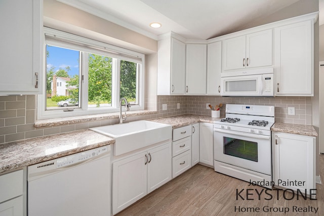 5896 Rollaway Dr NE, Comstock Park, MI 49321 - kitchen featuring white appliances, a sink, light wood-type flooring, white cabinets, and recessed lighting