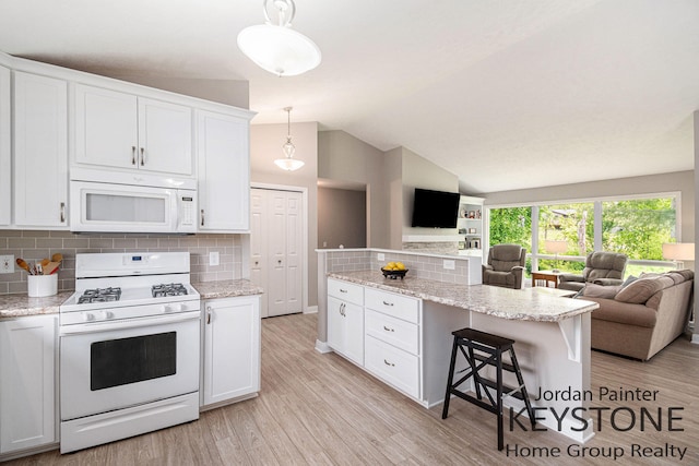 5896 Rollaway Dr NE, Comstock Park, MI 49321 - kitchen with white appliances, open floor plan, white cabinets, tasteful backsplash, and vaulted ceiling