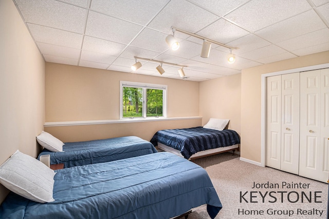 5896 Rollaway Dr NE, Comstock Park, MI 49321 - bedroom featuring carpet, track lighting, and a closet