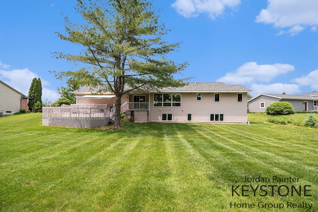 5896 Rollaway Dr NE, Comstock Park, MI 49321 - rear view of house featuring a wooden deck and a lawn