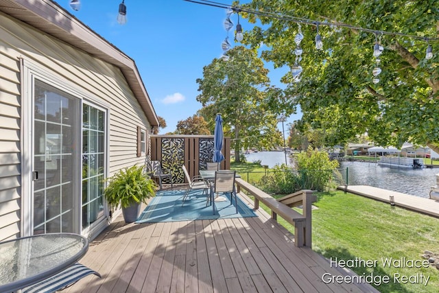 12683 Blue Lagoon Rd, Shelbyville, MI 49344 - wooden terrace featuring a water view and outdoor dining space