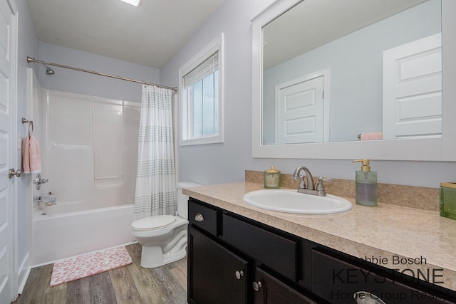 881 Cobblestone Way Dr SE, Byron Center, MI 49315 - bathroom with wood finished floors, vanity, shower / tub combo, and toilet