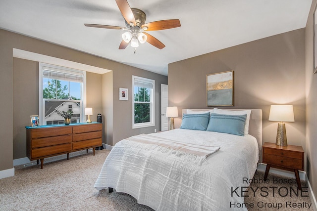 881 Cobblestone Way Dr SE, Byron Center, MI 49315 - carpeted bedroom with baseboards and ceiling fan