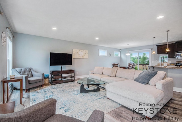 881 Cobblestone Way Dr SE, Byron Center, MI 49315 - living room with wood finished floors, recessed lighting, and baseboards