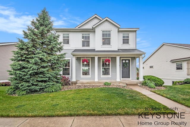 881 Cobblestone Way Dr SE, Byron Center, MI 49315 - traditional home with covered porch, board and batten siding, and a front yard