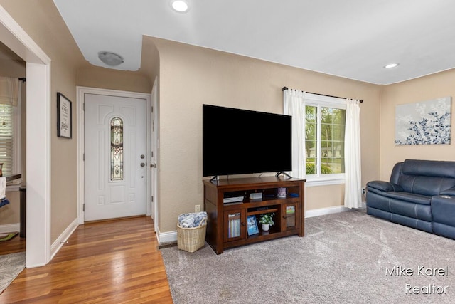 3674 Barker St, Hudsonville, MI 49426 - living area with baseboards, wood finished floors, and recessed lighting