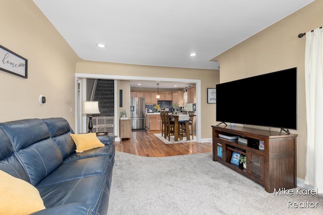3674 Barker St, Hudsonville, MI 49426 - carpeted living room featuring recessed lighting, wood finished floors, and baseboards
