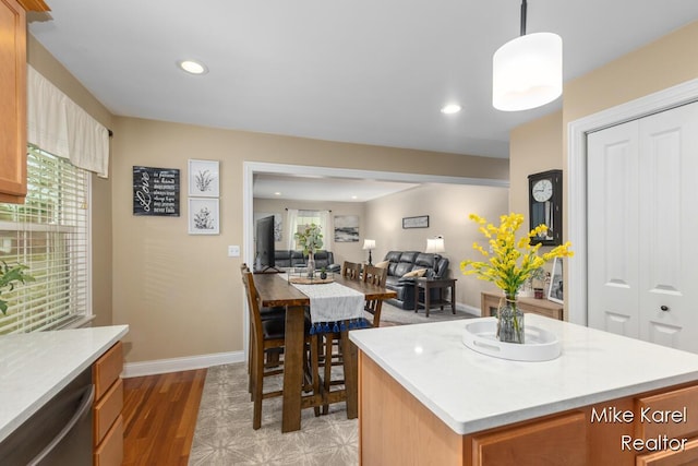 3674 Barker St, Hudsonville, MI 49426 - kitchen with stainless steel dishwasher, a center island, light countertops, recessed lighting, and open floor plan