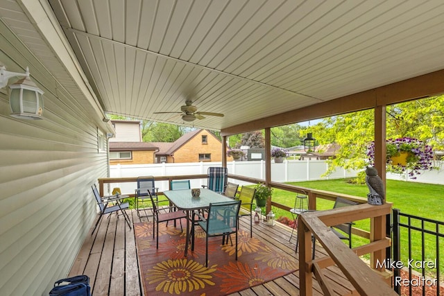 3674 Barker St, Hudsonville, MI 49426 - wooden deck with outdoor dining space and a ceiling fan