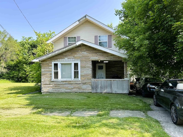 2318 Reid St, Flint, MI 48503 - view of front of property featuring a front yard and stone siding