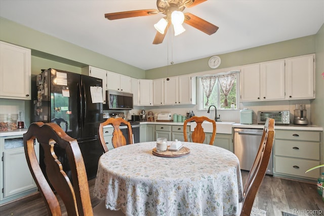 3889 Burnside Rd, Otter Lake, MI 48464 - dining room with ceiling fan and dark wood-type flooring