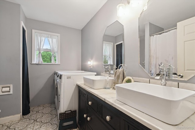 3889 Burnside Rd, Otter Lake, MI 48464 - full bath featuring washer and dryer, double vanity, and baseboards