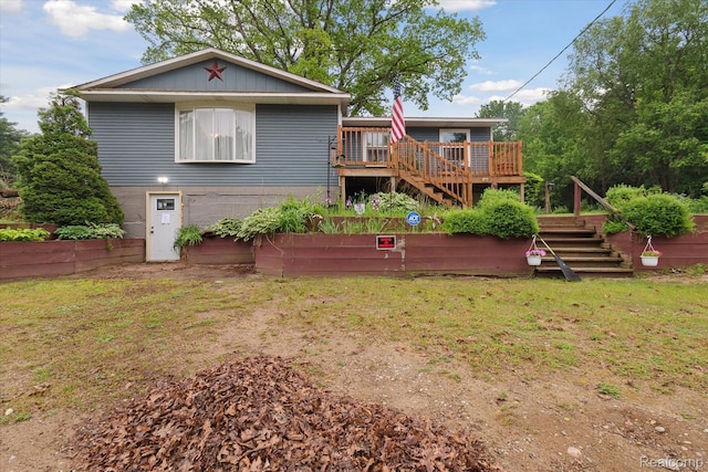 3889 Burnside Rd, Otter Lake, MI 48464 - back of house featuring stairs, a wooden deck, and a lawn