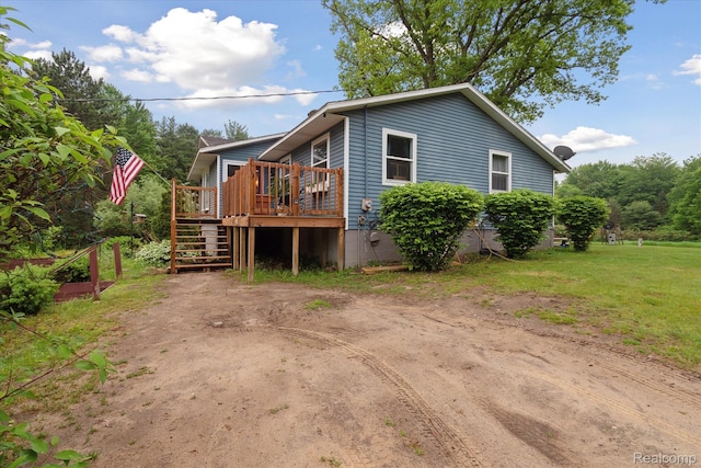3889 Burnside Rd, Otter Lake, MI 48464 - view of front facade with stairs and a deck
