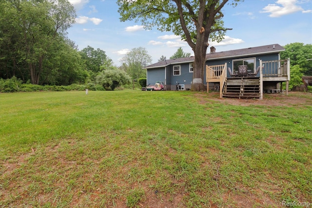 3889 Burnside Rd, Otter Lake, MI 48464 - view of grassy yard with a deck