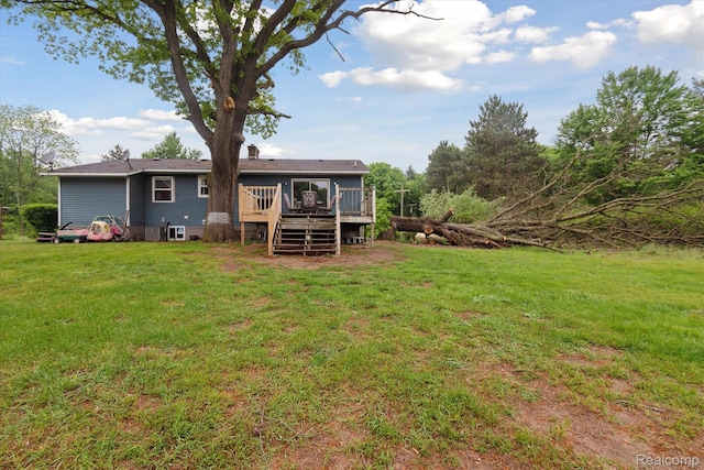 3889 Burnside Rd, Otter Lake, MI 48464 - rear view of property featuring a deck and a lawn