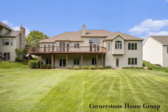 5273 S Silverstone Dr NE, Comstock Park, MI 49321 - rear view of house featuring a deck, a lawn, and a chimney