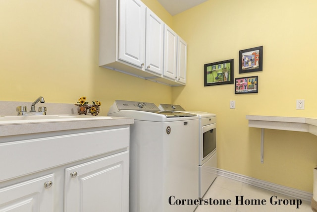5273 S Silverstone Dr NE, Comstock Park, MI 49321 - laundry area featuring washer and clothes dryer, cabinet space, light tile patterned floors, and baseboards