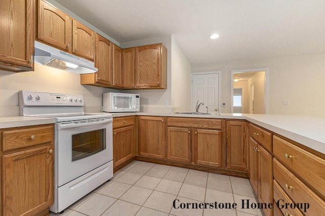 5273 S Silverstone Dr NE, Comstock Park, MI 49321 - kitchen featuring white appliances, under cabinet range hood, a sink, light countertops, and light tile patterned flooring